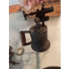 Image 12 : One metal blow torch with a wooden handle, one ribbed metal oil or fuel can, and a group of metal an