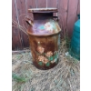 Image 5 : Two metal milk cans. One is decorated with hand-painted flower designs, and the other is solid green