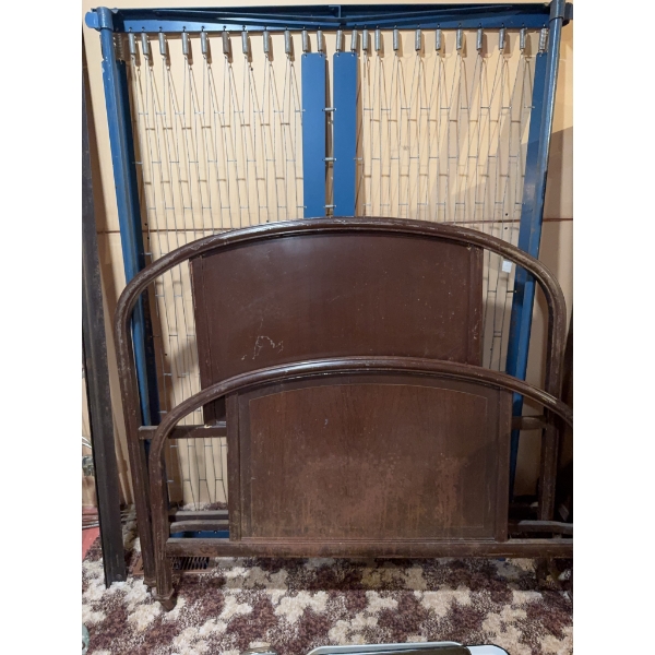 Vintage bed frame featuring both headboard and footboard. The structure consists of wood and metal c