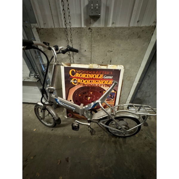 Schwinn folding electric bike a l one zero two zero model missing the battery and motor.