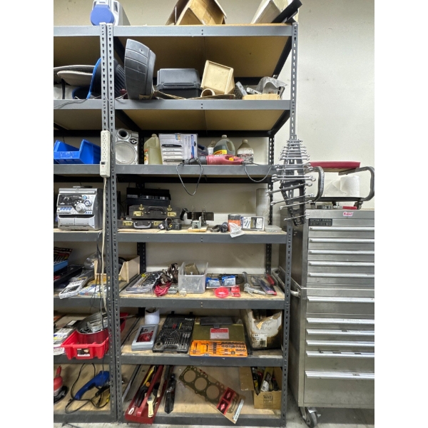 Metal shelving unit with 7 shelves, contents on shelving not included, it is 48in long, 9ft tall and