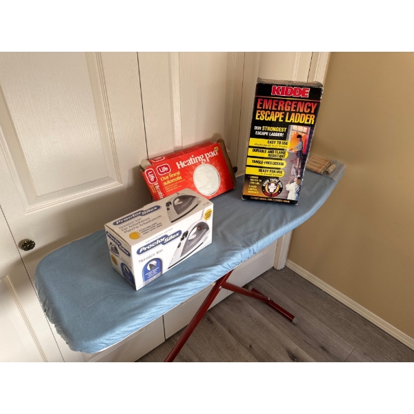 Ironing board with Proctor Silex nonstick iron, Life brand heating pad, and emergency escape ladder 