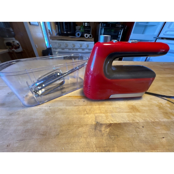 A Zhongshan Canxin Electrical Appliances hand mixer, model CX-6676-1, designed for household use. 
O