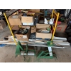 Image 1 : Two green metal drywall panel lifts, equipped with warning labels and hand cranks. Ideal for lifting