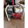 Image 1 : Honda GX120 4.0 engine with a pump mounted on a metal frame. Gas-powered model with pull start. Feat
