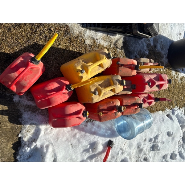 Pile of jerry cans including two diesel cans.