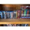 Image 1 : Indiana Jones, Star Trek, and other DVDs.