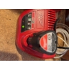 Image 2 : Milwaukee M12 cordless multi-tool with 12V Lithium-Ion battery, charger, and Milwaukee branded carry