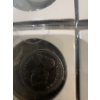 Image 25 : Canadian coins, featuring commemorative dollar coins and 50 cent pieces. Notable coins include a 197