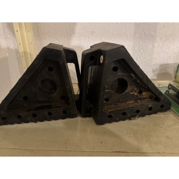 Rubber wheel chocks, designed to prevent vehicles from moving unintentionally while parked or during