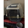 Image 2 : Pet carrier with handle and lockable cage door, 17.5in wide, 20in tall and 30in deep. 