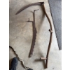 Image 2 : Traditional scythe with a wooden handle and metal blade, along with a metal adjustable hay rake atta