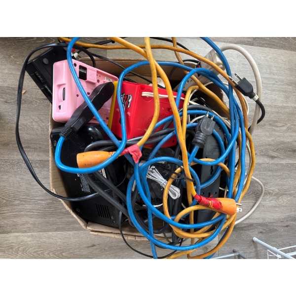 Box of alarm clocks, extension cords, multiple plug in extension cords and chargers