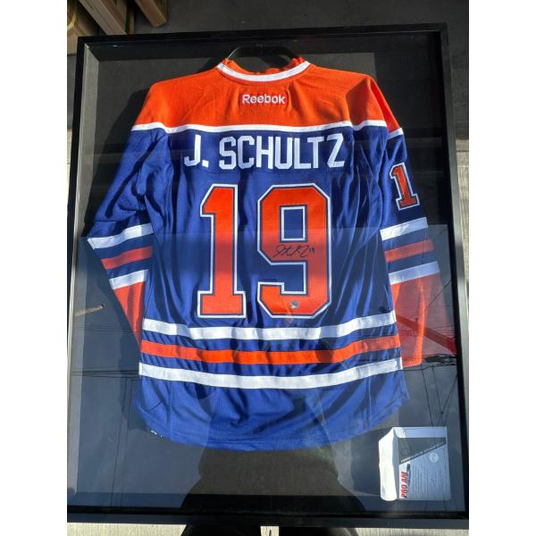 J Shultz signed jersey with certificate of authenticity in in framed picture frame, 33 inches wide b