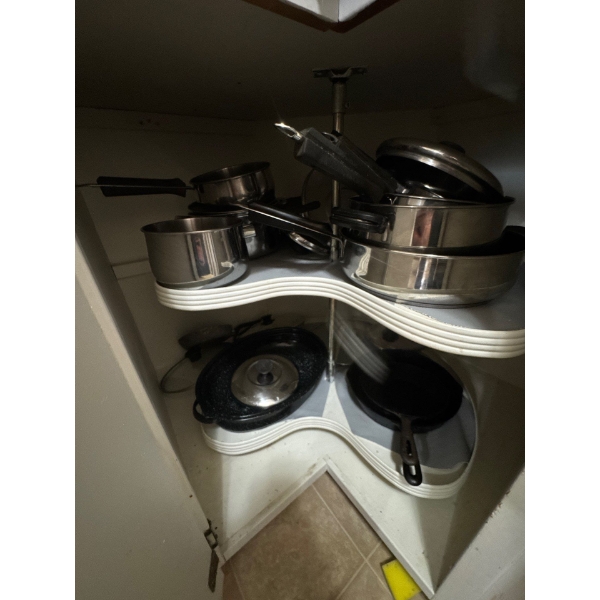 cast iron pans. All pan cooking ware included. Everything in cabinet.