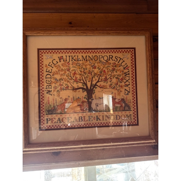  framed needlework sampler titled "Peaceable Kingdom," designed by artist Ellen Stouffer. 
Artist: E
