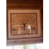 Image 1 :  framed needlework sampler titled "Peaceable Kingdom," designed by artist Ellen Stouffer. 
Artist: E