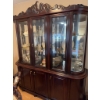 Image 1 : This mahogany china cabinet features glass doors, mirrored back, and interior glass shelving for dis