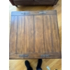 Image 4 :  Rustic wooden coffee table featuring a hinged top for storage and metal accents.   