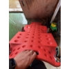 Image 3 : Red plastic rolling creeper with casters, designed for automotive work. Features include built-in ha