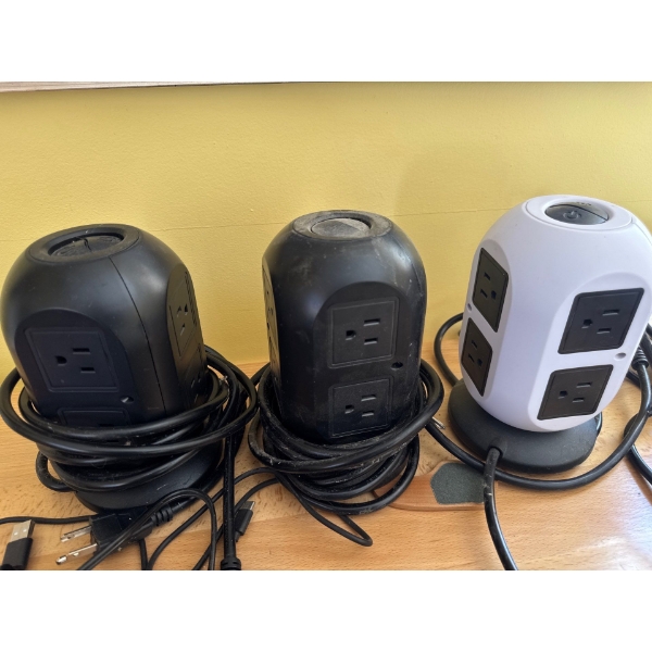 vertical power strip towers with multiple AC outlets and USB ports. 
Outlets: Generally feature 8 AC
