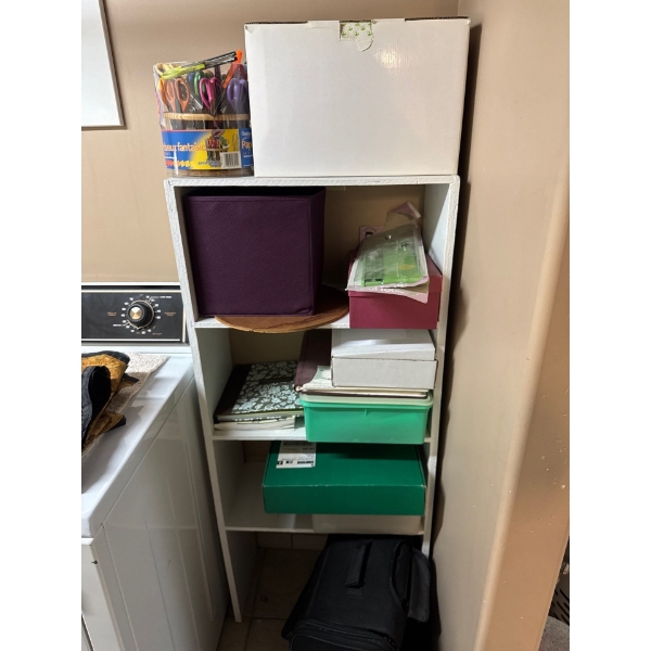Shelf with all contents included, including bag at bottom.  Scrapbooking or card making supplies