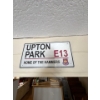 Image 1 : A decorative metal sign plaque featuring the text "UPTON PARK E13 HOME OF THE HAMMERS" and the West 