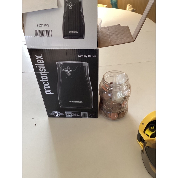 , jar of pennies, and electric can opener.