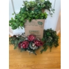 Image 1 :  various artificial plants and floral arrangements in baskets, which are commonly used for seasonal 