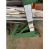 Image 2 : Two green metal drywall panel lifts, equipped with warning labels and hand cranks. Ideal for lifting