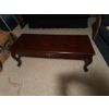 Image 4 : Rectangular wooden coffee table featuring a decorative brass-style drawer pull on the front and cabr