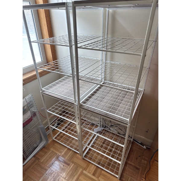 Two shelving racks and the wire shelving rack kit included. Dimensions are 16 and a quarter by 53 ta
