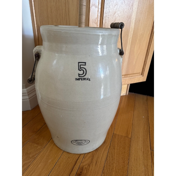 This is a vintage 5-gallon stoneware butter churn manufactured by Medalta Potteries Ltd. in Medicine