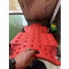 Image 2 : Red plastic rolling creeper with casters, designed for automotive work. Features include built-in ha