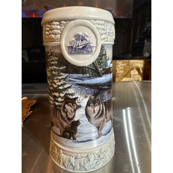 The 1999 Miller Brewing Company Holiday stein featuring December dusk by Eric Bryant. Number 077329