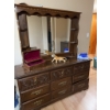 Image 2 : This vintage-style wooden dresser features ornate carved drawer fronts, brass-colored handles, and a