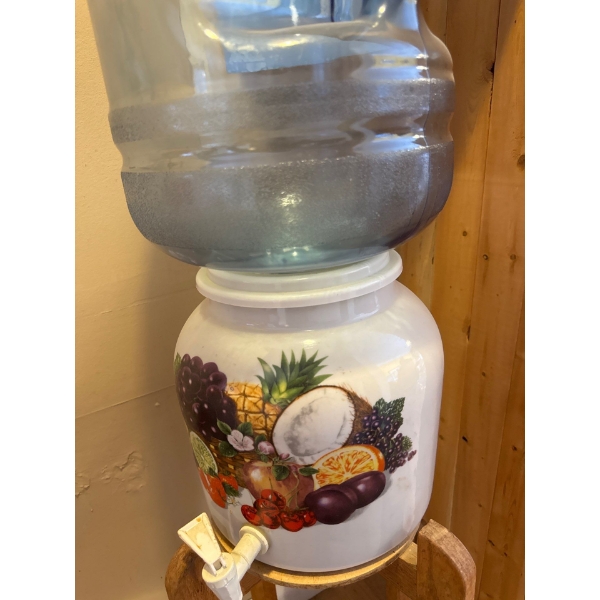 A Tropical Fruits Ceramic Water Dispenser with a Stand, designed to hold 3- or 5-gallon water jugs. 