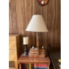 Image 1 : This is a dark metal candlestick holder with a thick, white, faux-wax candle 
