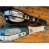 Image 1 : Two Black+Decker handheld vacuums, commonly known as Dustbusters. The top model is likely a 20V Lith