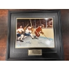 Image 1 :  framed sports collectible is titled "A Clash of Titans" and features autographed images of hockey l