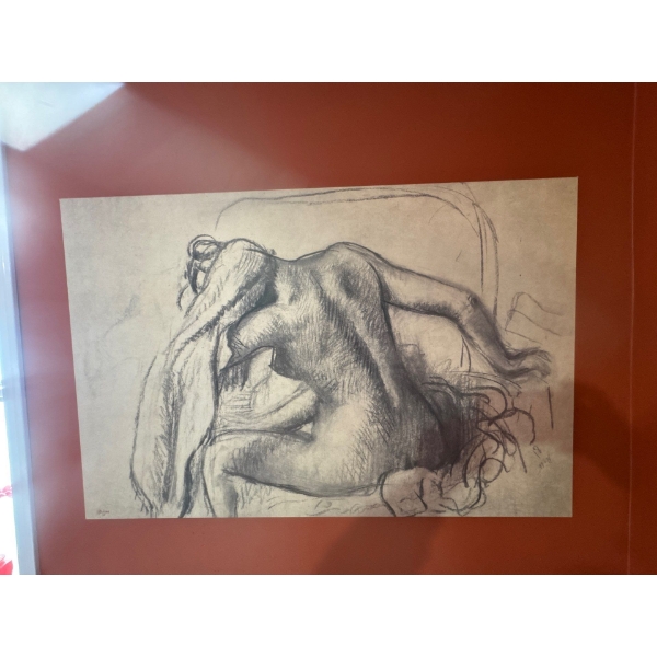 This is a print of "La Toilette" (also known as "Woman Combing Her Hair") by the French Impressionis