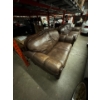 Image 1 : Leather two seater sofa. 69 inches long. By 37 inches wide.