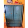 Image 2 : This item is a green Ethan Allen TV armoire featuring two doors for storage above two drawers, it is