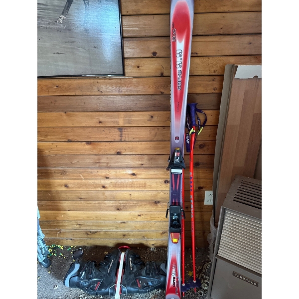 alpine skiing equipment, likely for a beginner or intermediate skier. 
Items: A pair of Rossignol C