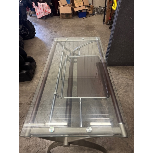 Glass computer desk. 47 inches long. 23 and a half wide, 30 inches high.