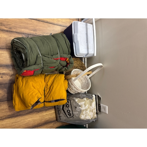 Miscellaneous camping items such as table cloths, picnic basket, small rubbermaid cooler and two sin
