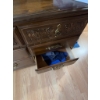 Image 8 : This vintage-style wooden dresser features ornate carved drawer fronts, brass-colored handles, and a