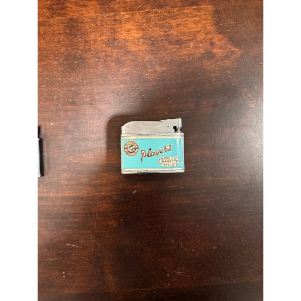  vintage "Player's Navy Cut" lighter featuring the iconic sailor logo. 
Type: Tobacco advertising li