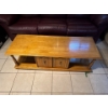 Image 6 :  vintage-style wooden coffee table features a rectangular top, sturdy turned legs, and built-in stor