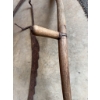 Image 3 : Traditional scythe with a wooden handle and metal blade, along with a metal adjustable hay rake atta